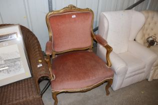 An antique French gilt framed armchair