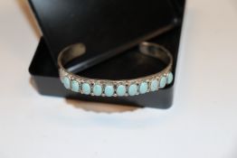 A Navajo Sterling silver and turquoise torque bang
