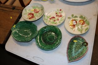 A quantity of green glazed leaf pattern plates, Fr