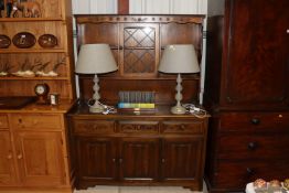 An oak dresser with leaded glazed panel door