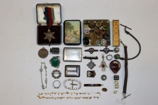 A box containing the 1939-1945 Star, various badge