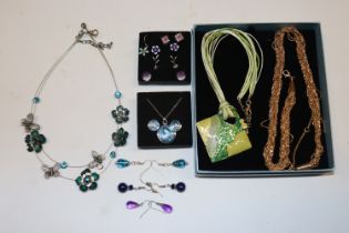 A box of costume jewellery to include necklaces an