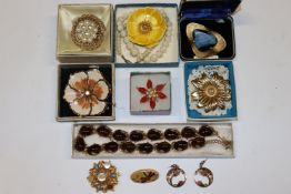 A box of vintage and other costume brooches, ear-r