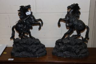 A pair of Spelter Marley horse and groom ornaments
