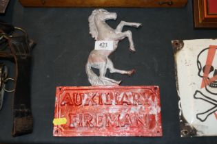 A WWII auxiliary fireman's metal door plaque