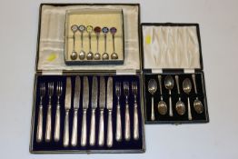 A cased set of six silver teaspoons; a cased set o