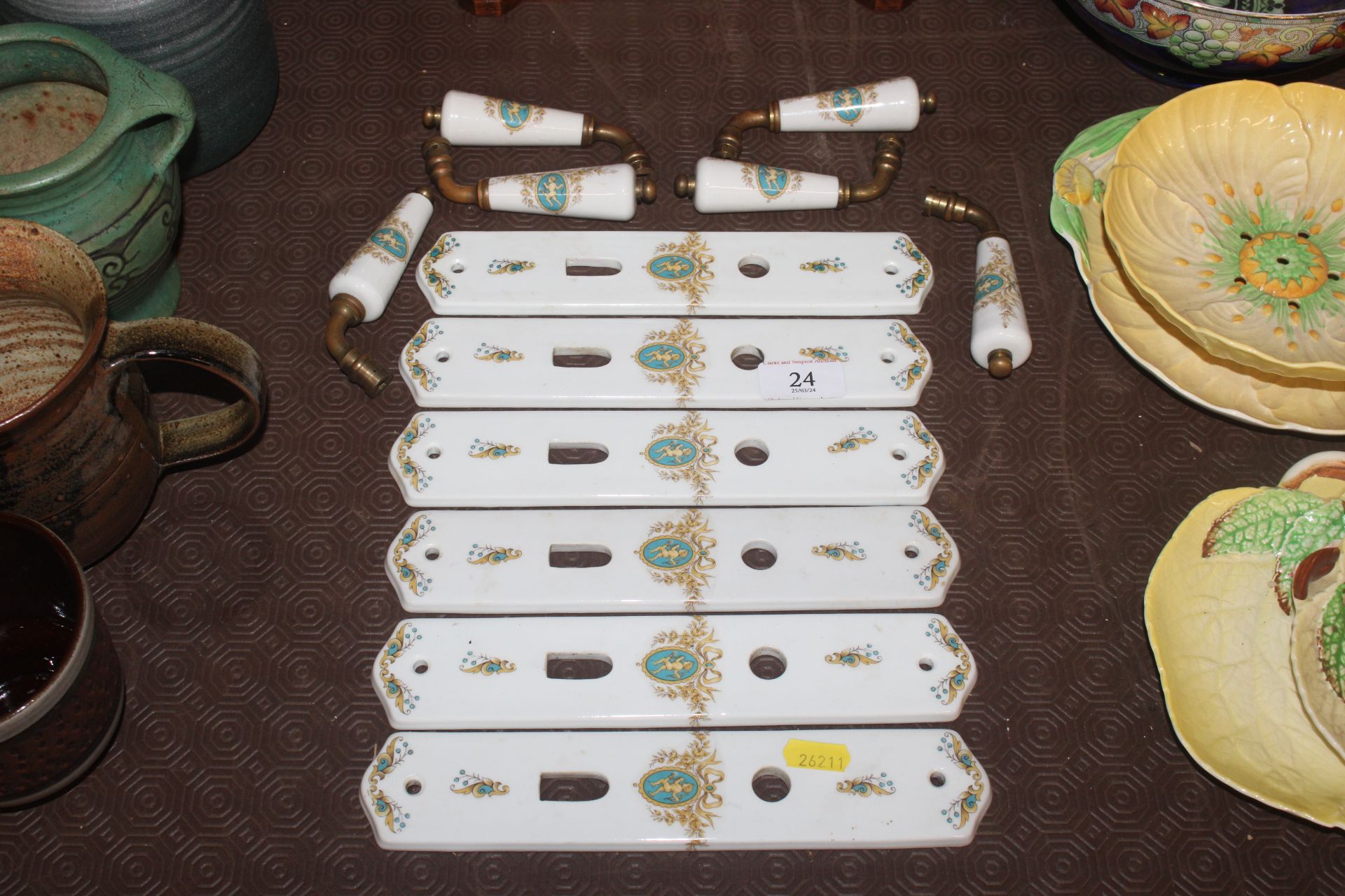 Six Limoges porcelain door finger plates and match