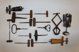 A box containing vintage and other corkscrews