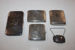 Three silver cigarette cases; a silver card case a