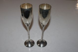 A pair of tall silver plated goblets