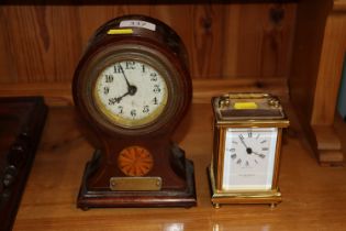 An inlaid balloon cased mantel timepiece with bras