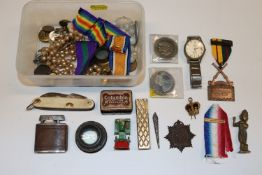 A box of mixed items including pocket knife, neckl