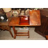 An late Victorian mahogany reading table, with rat
