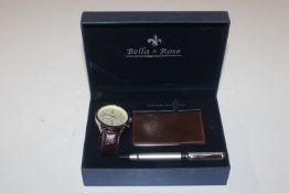 A boxed Bella & Rose wrist watch, pen and business