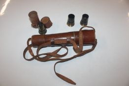 A brass and leather telescope marked "Reconditione
