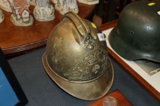 A French early 20th Century brass fireman's helmet