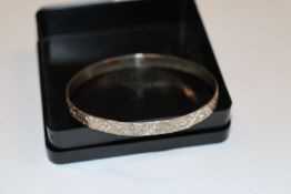 A vintage silver full bangle, approx. 10.5gms