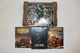 A box of Warhammer books, comics, Epic game cards