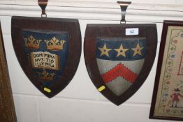 A pair of Heraldic shields on oak plaques