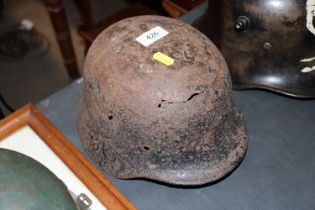 A German WWII helmet shell, found in Normandy