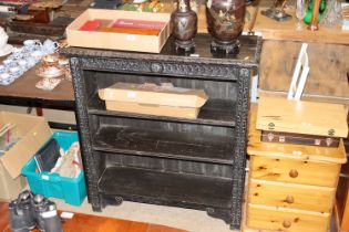 A Victorian carved oak bookcase