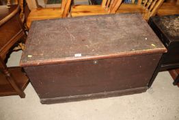 An antique pine trunk with rope work carrying hand