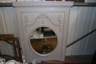 A decorative grey painted wall mirror