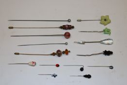 A collection of stick pins and hat pins