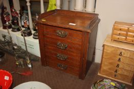 A miniature Wellington style chest and contents of
