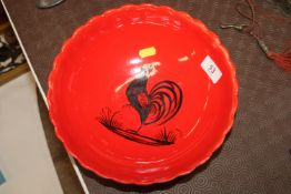 A Henriot Quimper red glazed bowl with cockerel de