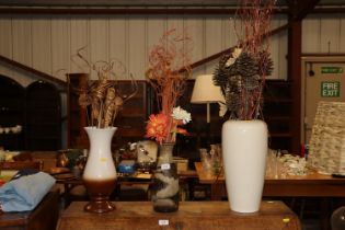 Three decorative pottery vases and imitation flowe