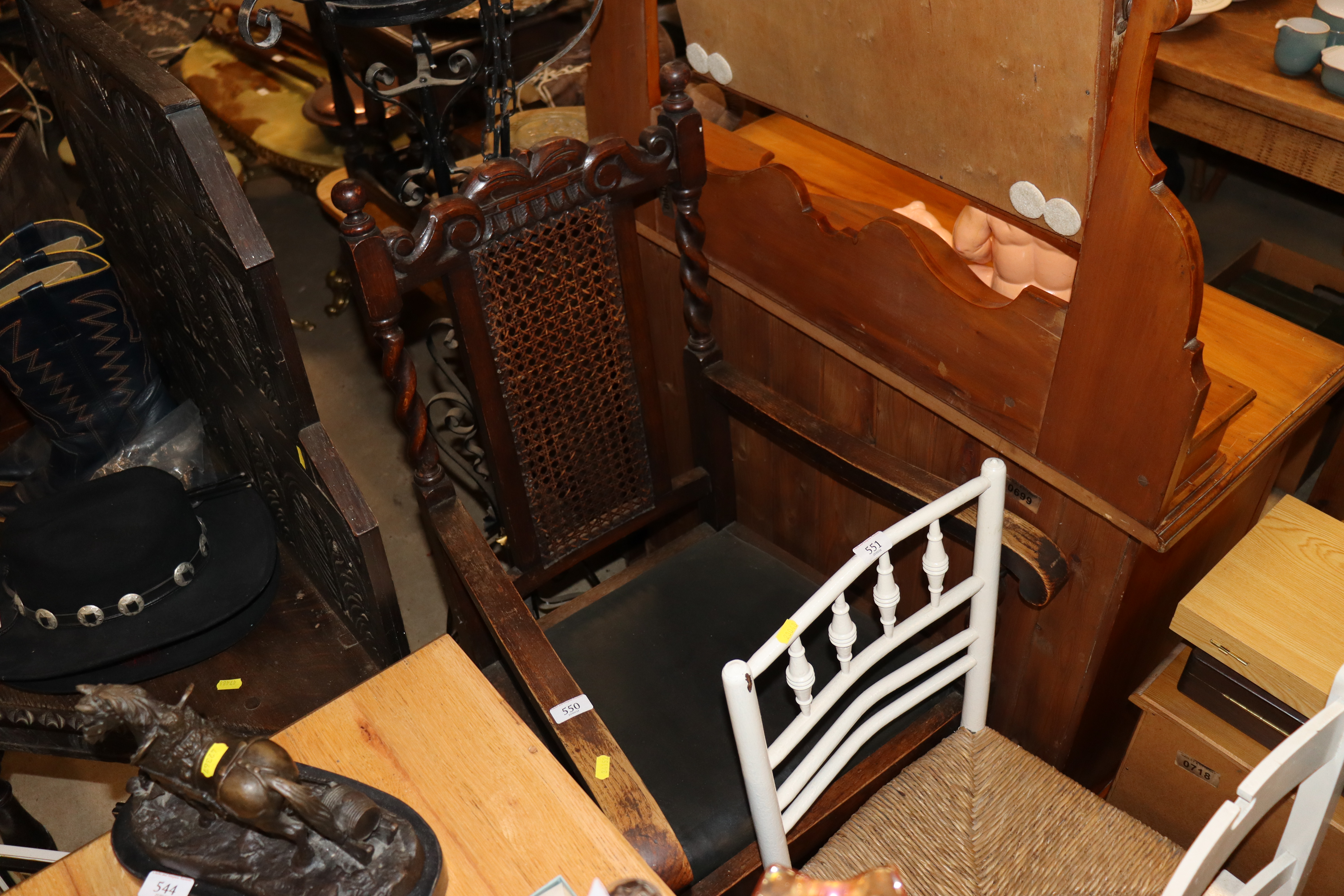 A 1920's oak elbow chair with barley twist columns