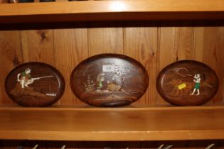 Three Indian oval hardwood wall plaques with inlai