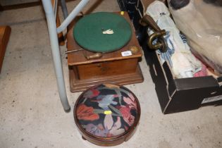 A wind-up gramophone (incomplete) and a circular w