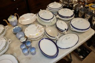 A collection of blue banded tureens and other dinn