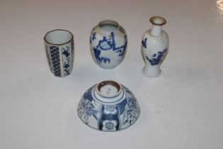 An Oriental blue and white vase decorated with a d