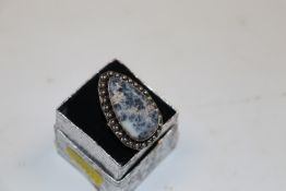A white metal blue agate set ring