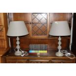 A pair of grey table lamps and shades