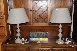 A pair of grey table lamps and shades