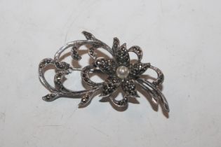 A vintage silver and marcasite spray brooch