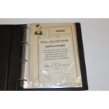 A folder of German WWI and WWII ephemera all relat