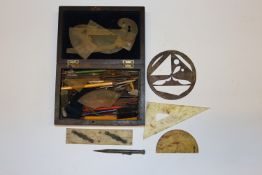 A box containing drawing instruments, pencils etc.