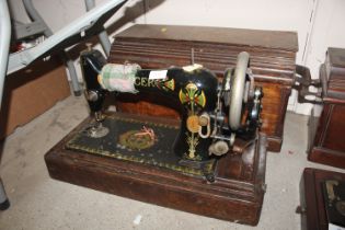 An oak cased Singer sewing machine