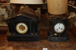 A Victorian black marble mantel clock with eight d