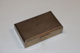 A silver cigarette box initialled an dated 26/11/6