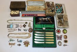 A box containing various boxes of costume jeweller