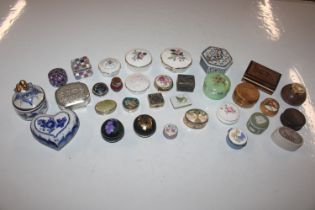A box containing various pill boxes, trinket boxes