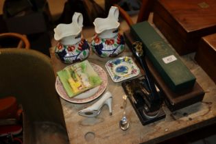 Two ironstone style baluster jugs; a cased bone ch