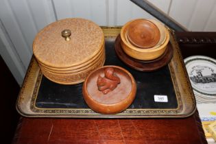 A papier mâché tea tray; an Eastern carved wooden