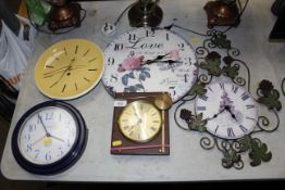 A collection of wall clocks